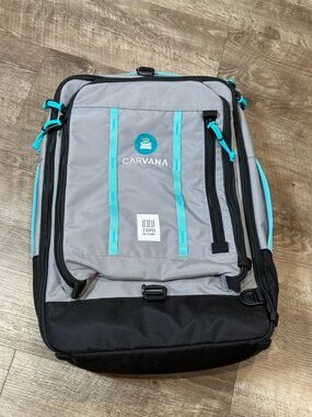 Topo Designs Global Travel Bag 40L Backpack. Carvana logo grey/teal
